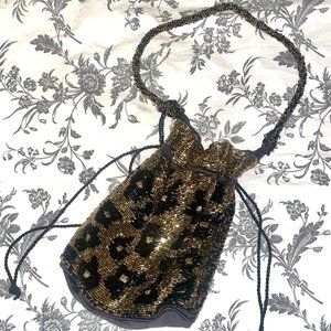 Drawstring sequin cheetah crossbody bag